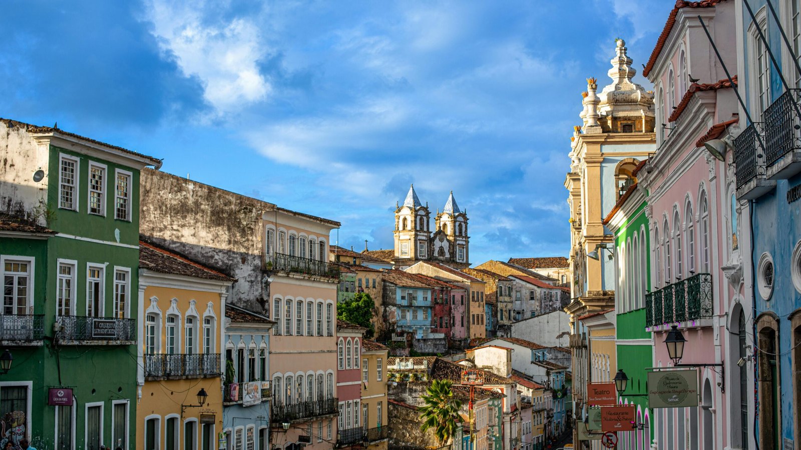 Vibrant colonial buildings line the streets of Salvador's historic center.